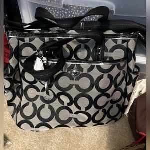 Brand new with tags Coach diaper bag.